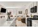 Spacious island kitchen that flows into a cozy living room with a fireplace at 4635 S Odessa St, Centennial, CO 80015