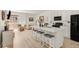 Open concept kitchen with stainless appliances and adjacent living area for seamless entertaining at 4635 S Odessa St, Centennial, CO 80015