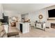 Open living area with a kitchen, dining area, and fireplace at 4635 S Odessa St, Centennial, CO 80015