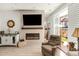 Stylish living room with fireplace, tile surround, and sliding glass door to yard at 4635 S Odessa St, Centennial, CO 80015