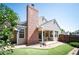 Private backyard with brick chimney and cozy patio area perfect for outdoor seating and entertaining at 5351 S Cody St, Littleton, CO 80123