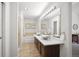 Elegant bathroom with double sinks, sleek countertop, and a separate shower and soaking tub at 5351 S Cody St, Littleton, CO 80123