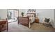 Bedroom with natural light, a sliding door to backyard, and a wood bed frame at 5351 S Cody St, Littleton, CO 80123