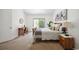 Bright bedroom with sliding glass door, desk, and a bed with cozy bedding at 5351 S Cody St, Littleton, CO 80123