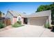 Charming home with a well-maintained lawn, large driveway and attached two-car garage at 5351 S Cody St, Littleton, CO 80123