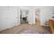 Bright foyer with double French doors leading to the living room and a glimpse of the adjacent bathroom at 5351 S Cody St, Littleton, CO 80123