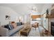 Cozy living room with hardwood floors, fireplace, and a comfortable seating arrangement at 5351 S Cody St, Littleton, CO 80123