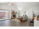 Spacious living room featuring a fireplace, vaulted ceiling, and sliding glass doors to the patio at 5351 S Cody St, Littleton, CO 80123