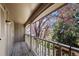 Relaxing balcony with wood floors and a view of the trees at 7101 W Yale Ave # 3403, Denver, CO 80227