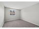 Standard bedroom with carpet flooring and a large window at 7101 W Yale Ave # 3403, Denver, CO 80227