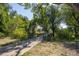 Picturesque view of a bridge along a paved path, surrounded by lush greenery and mature trees at 7101 W Yale Ave # 3403, Denver, CO 80227