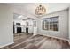 Dining room with black appliances, wood floors, and ample natural light at 7101 W Yale Ave # 3403, Denver, CO 80227