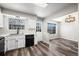 Kitchen featuring white cabinets, modern appliances, and an adjacent dining area at 7101 W Yale Ave # 3403, Denver, CO 80227