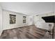 Spacious living room featuring wood floors, fireplace, and natural light at 7101 W Yale Ave # 3403, Denver, CO 80227