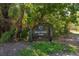 Entrance to Bear Creek Park with lush greenery, and mature trees, inviting for outdoor activities at 7101 W Yale Ave # 3403, Denver, CO 80227