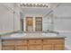 Bathroom with double sinks and ample counter space, under a large well-lit mirror for convenience at 5960 S Estes St, Littleton, CO 80123