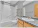 Functional bathroom with a tub-shower, toilet, and vanity, all neatly arranged and well-maintained at 5960 S Estes St, Littleton, CO 80123