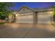 Charming home featuring a two-car garage and a well-maintained driveway and front yard at 5960 S Estes St, Littleton, CO 80123