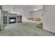 Bright living room featuring neutral walls, a fireplace, and entryway at 5960 S Estes St, Littleton, CO 80123