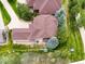 Overhead aerial view of a home, highlighting the roof, landscaping, and surrounding greenery at 23961 E Easter Pl, Aurora, CO 80016