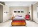 Spacious bedroom with tan carpet, large windows, and neutral wall colors at 23961 E Easter Pl, Aurora, CO 80016