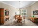 Formal dining room with classic wood furniture, chandelier, and large window with blinds at 23961 E Easter Pl, Aurora, CO 80016