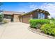 Charming single-Gathering home showcasing a stone and brown exterior, complemented by a spacious driveway and lush landscaping at 23961 E Easter Pl, Aurora, CO 80016
