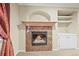 Close-up of a fireplace featuring unique stone, built in cabinets, and stone accents at 23961 E Easter Pl, Aurora, CO 80016