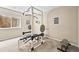 Home gym featuring a weight rack, weights, and a bright window with natural light at 23961 E Easter Pl, Aurora, CO 80016