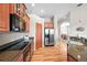 Modern kitchen with wood cabinets, stainless steel appliances, and a granite countertop at 23961 E Easter Pl, Aurora, CO 80016