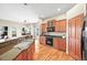Well-equipped kitchen with granite countertops, wood cabinetry, and stainless steel appliances at 23961 E Easter Pl, Aurora, CO 80016