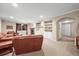 Cozy living room with a fireplace, built-in shelves, and comfortable seating at 23961 E Easter Pl, Aurora, CO 80016