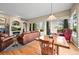 Cozy living area with hardwood floors, a fireplace, and access to the outdoors at 23961 E Easter Pl, Aurora, CO 80016