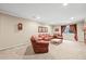 Comfortable living room featuring carpet floors, recessed lighting, and a fireplace at 23961 E Easter Pl, Aurora, CO 80016