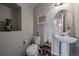 Clean bathroom with pedestal sink and updated fixtures at 5199 S Fairplay St, Aurora, CO 80015