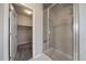 Clean bathroom with walk-in shower and adjacent closet at 5199 S Fairplay St, Aurora, CO 80015