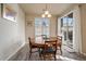 Charming dining room with a round table and access to a patio at 5199 S Fairplay St, Aurora, CO 80015