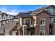 Brick townhouse with private balcony, showcasing modern design and a desirable location at 5199 S Fairplay St, Aurora, CO 80015