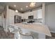 Modern kitchen with stainless steel appliances and white cabinetry at 5199 S Fairplay St, Aurora, CO 80015