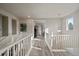 Spacious upstairs hallway with hardwood floors and natural light at 5199 S Fairplay St, Aurora, CO 80015