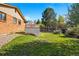 Backyard featuring grassy lawn, shed, and fencing at 14793 E Hampden Pl, Aurora, CO 80014
