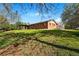 Spacious backyard with covered patio, lush lawn, and shed at 14793 E Hampden Pl, Aurora, CO 80014
