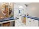 Spacious bathroom with extended vanity and ornate mirror at 14793 E Hampden Pl, Aurora, CO 80014