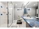 Bathroom featuring modern sink and shower stall at 14793 E Hampden Pl, Aurora, CO 80014