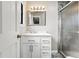 Bathroom with marble countertop vanity with chrome hardware and glass shower stall at 14793 E Hampden Pl, Aurora, CO 80014