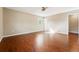 Large bedroom with wood floors, a ceiling fan, and ample natural light at 14793 E Hampden Pl, Aurora, CO 80014