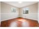 This bedroom has hard wood floors and lots of light with 2 large windows at 14793 E Hampden Pl, Aurora, CO 80014