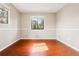 This bedroom has hard wood floors and lots of light with large windows at 14793 E Hampden Pl, Aurora, CO 80014