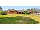 Charming brick home with manicured lawn, two-car garage, arched brick entryway, and mature landscaping at 14793 E Hampden Pl, Aurora, CO 80014
