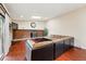 Spacious living room features a brick fireplace, hardwood floors, skylight and a large comfortable sectional at 14793 E Hampden Pl, Aurora, CO 80014